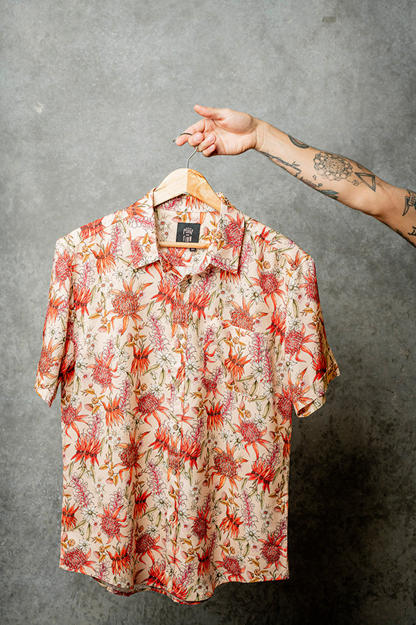 Hanging casual shirt in nude with red, pink, and green floral accents