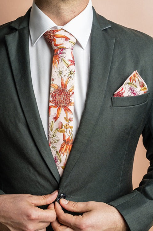 Sophisticated pocket square crafted from soft, 100% cotton fabric, adorned with an artistic print of Australian native flowers in a lush array of colors