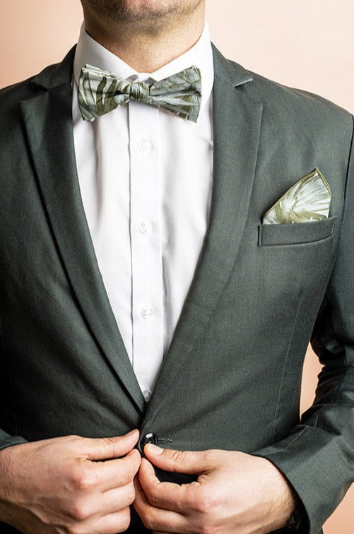 Stylish cotton pocket square with a detailed fan palm pattern in vibrant green hues, ideal for enhancing a suit at weddings or special events