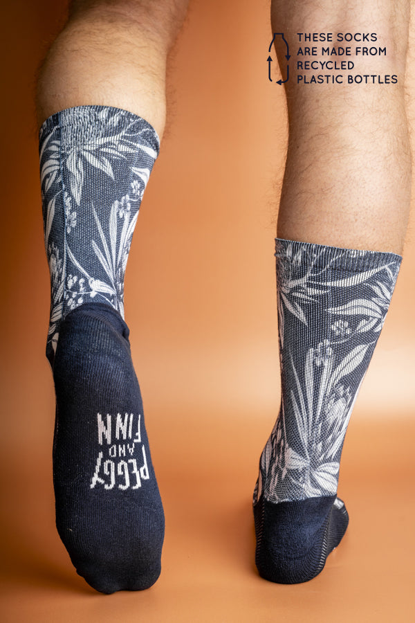 Eco-friendly socks featuring a vibrant print of Australian native plants in deep blue and white, perfect for the environmentally conscious