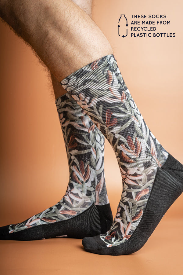 Recycled polyester socks showcasing a stylish Protea print in forest green, blending comfort with environmental responsibility