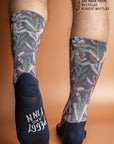 Eco-friendly socks in navy, featuring a Protea flower print in shades of pink and white, perfect for sustainable style