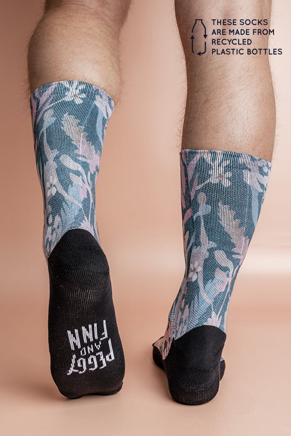 Eco-friendly socks with a Teal Blooms print, featuring sea foam, rose pink, white, peach, and baby pink hand-painted blooms, inspired by ocean colors